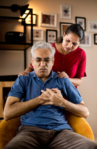 An old man suffered from angina pain and take treatment at Santosh Homoeo Hall and clinic