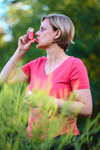 An asthmatic patient take inhaler and take treatment at Santosh Homoeo Hall and Clinic