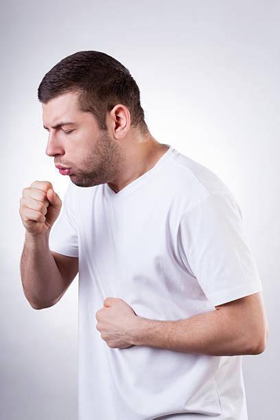 A man during coughing and take treatment at Santosh Homoeo Hall and clinic